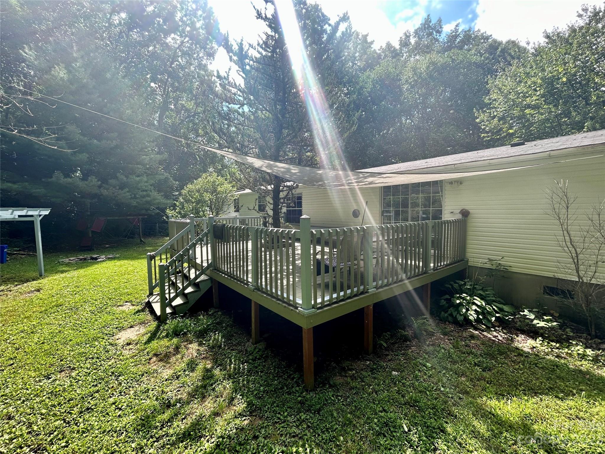 71 Bear Trail Fairview, NC 28730 - Photo 7 of 42 a garden with trees in front of it