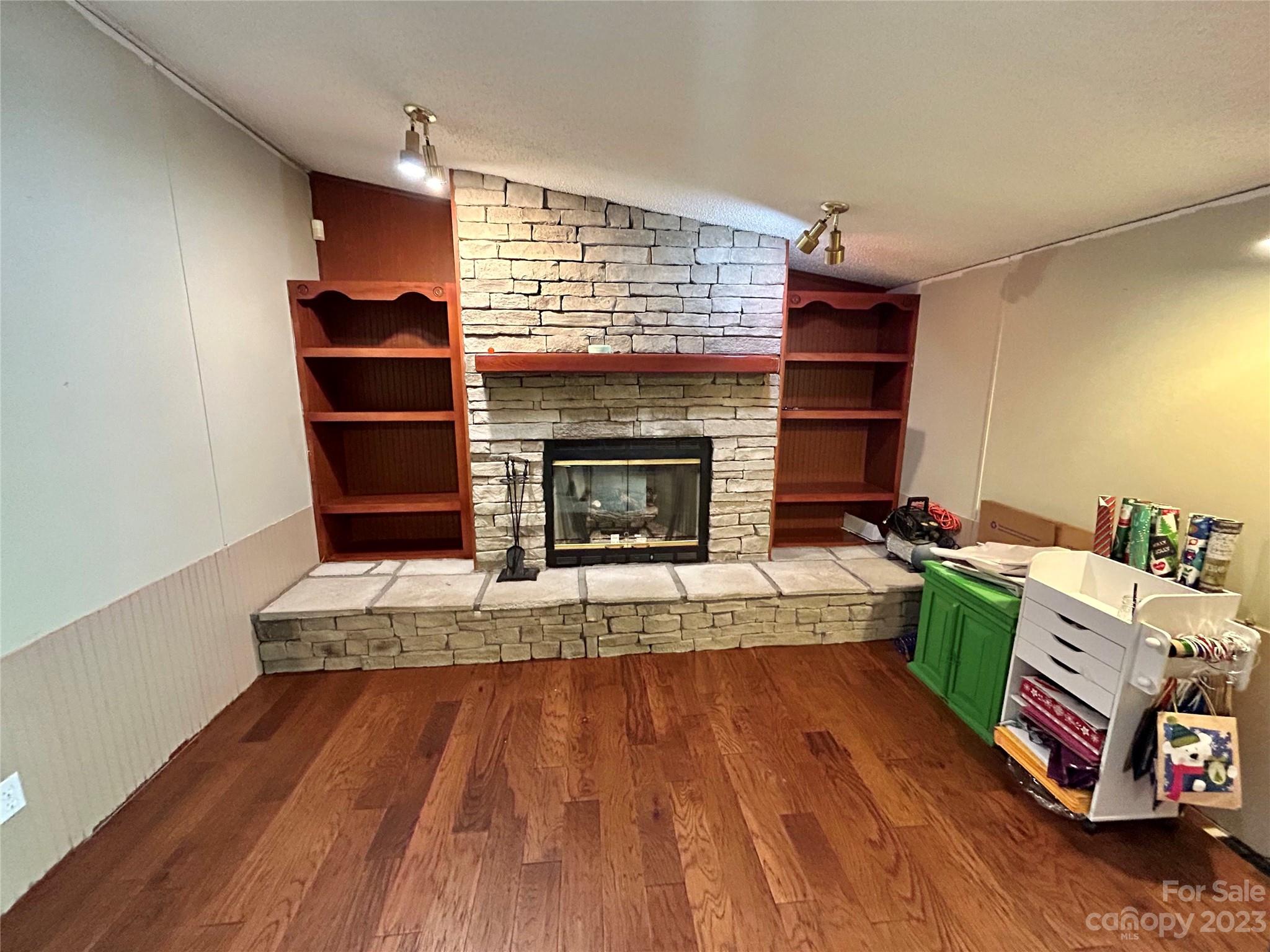 71 Bear Trail Fairview, NC 28730 - Photo 10 of 42 a living room with furniture and a fireplace