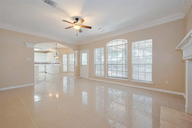 a view of an empty room with a window