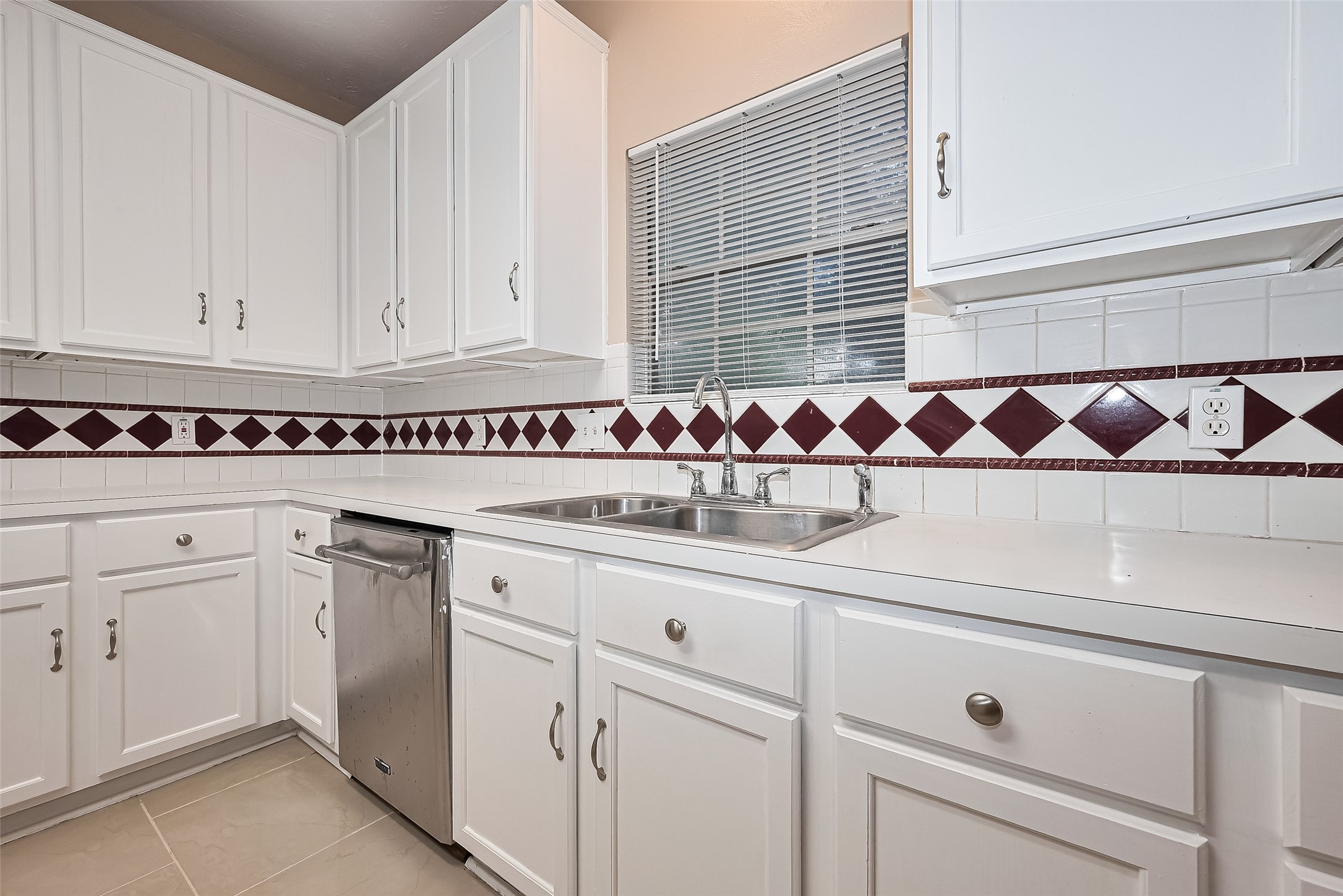 24310 Pepperrell Pl Street Katy, TX 77493 - Photo 16 of 35 a kitchen with white cabinets and sink