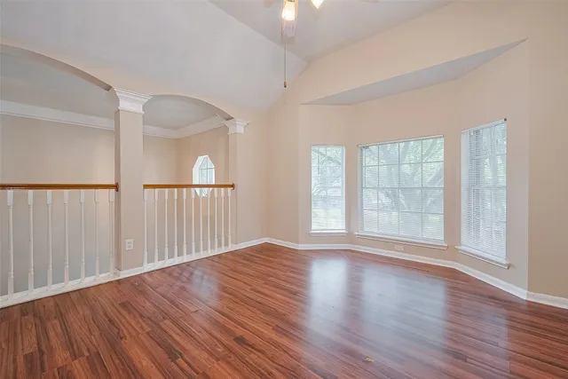 wooden floor in an empty room with windows