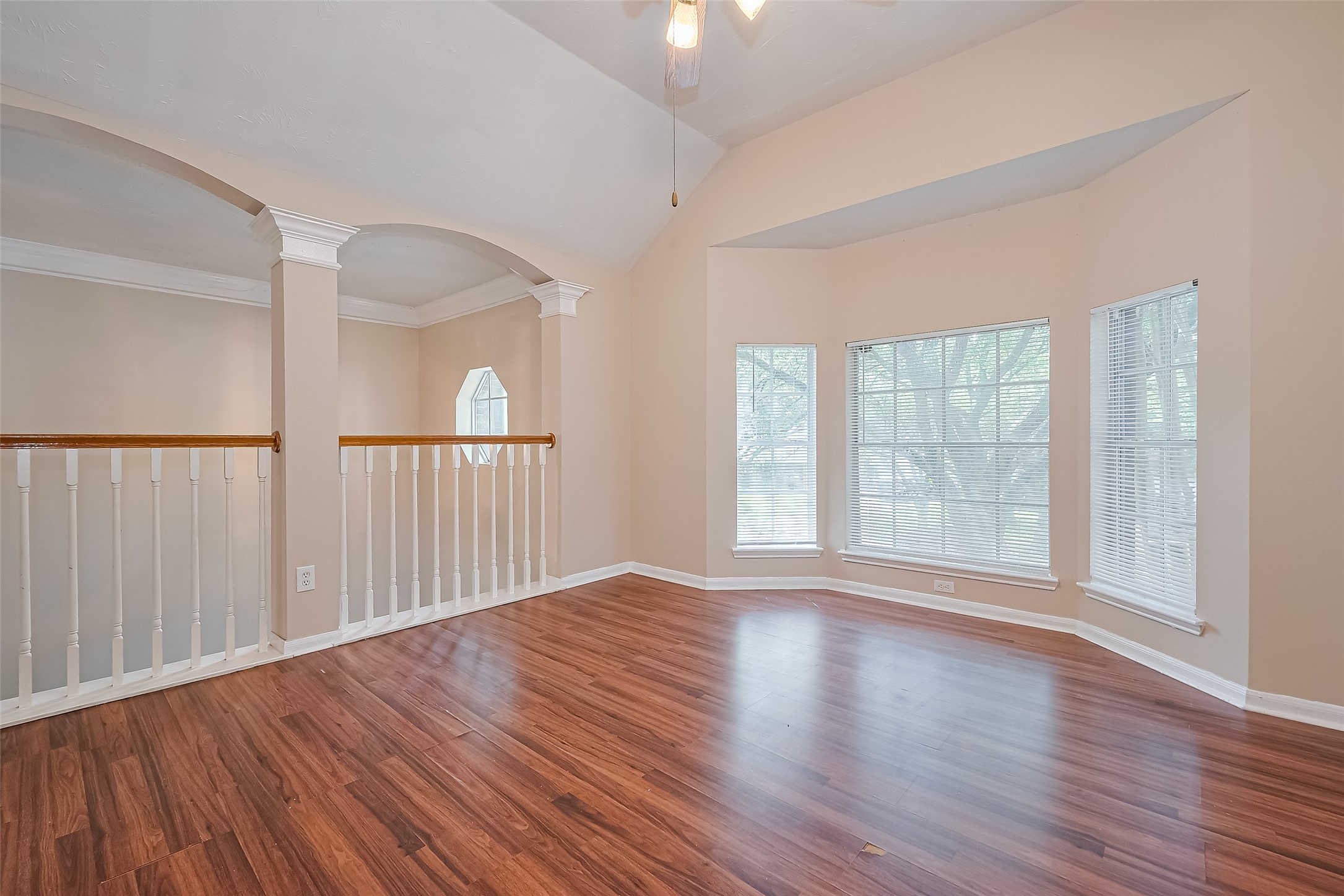 24310 Pepperrell Pl Street Katy, TX 77493 - Photo 20 of 35 wooden floor in an empty room with windows