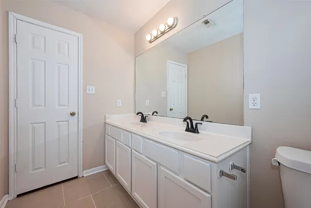 a bathroom with a sink and mirror