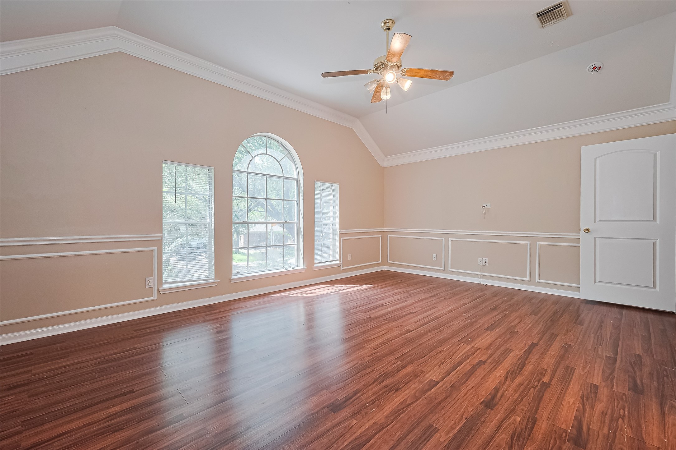 24310 Pepperrell Pl Street Katy, TX 77493 - Photo 25 of 35 an empty room with wooden floor chandelier fan and windows