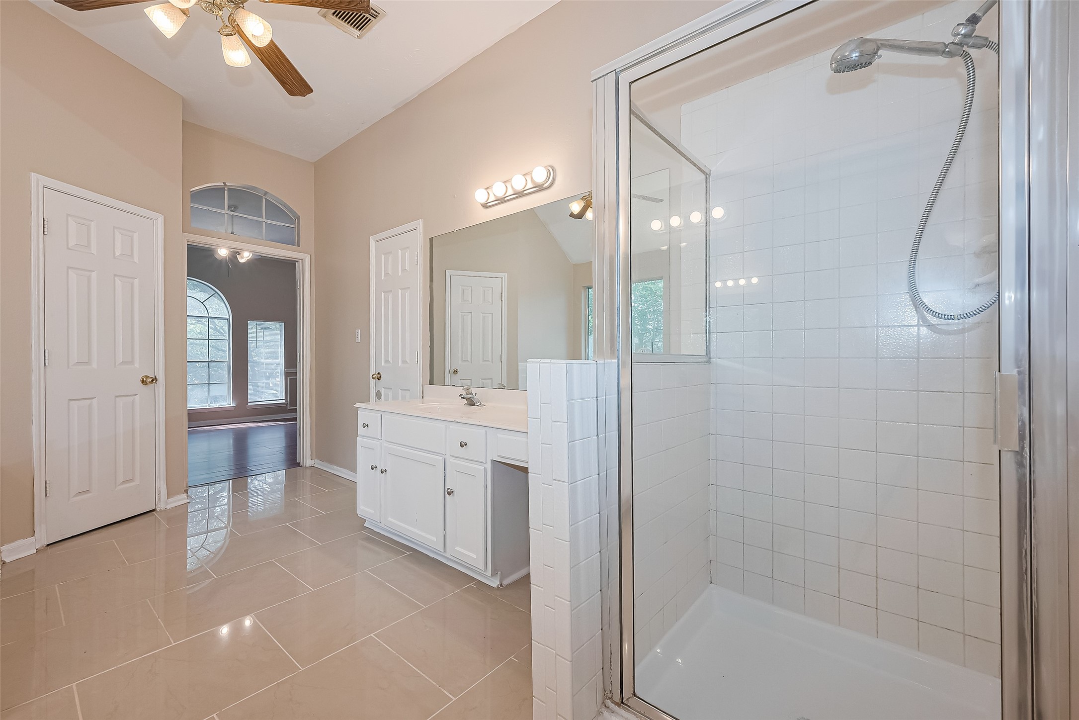 24310 Pepperrell Pl Street Katy, TX 77493 - Photo 30 of 35 a bathroom with a granite countertop sink a toilet a shower and a mirror