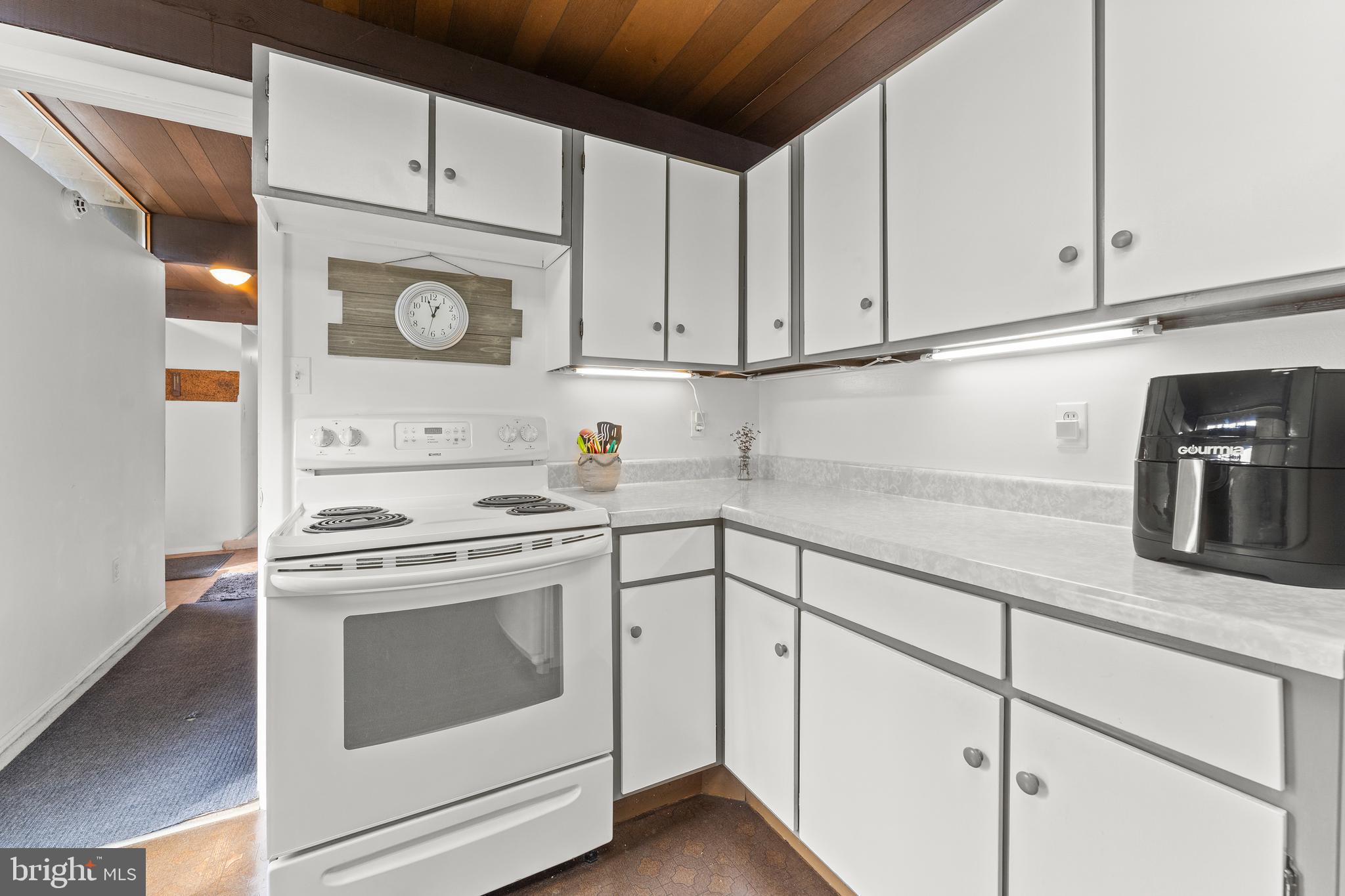 7202 Danny Lane Manassas, VA 20112 - Photo 16 of 54 a kitchen with granite countertop white cabinets white stainless steel appliances and sink