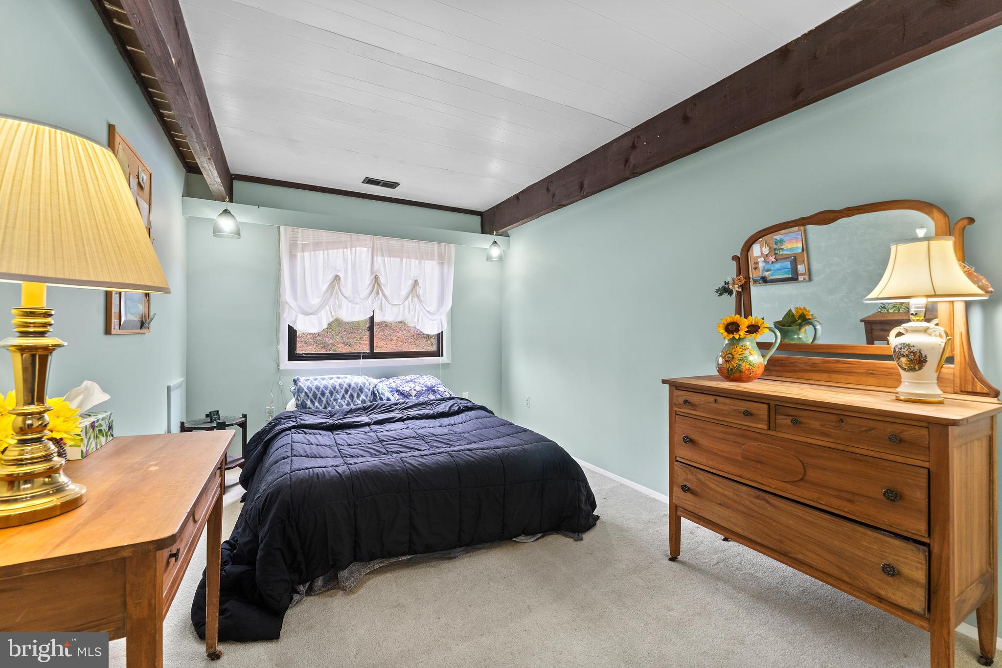 7202 Danny Lane Manassas, VA 20112 - Photo 32 of 54 a bedroom with a bed and a dresser