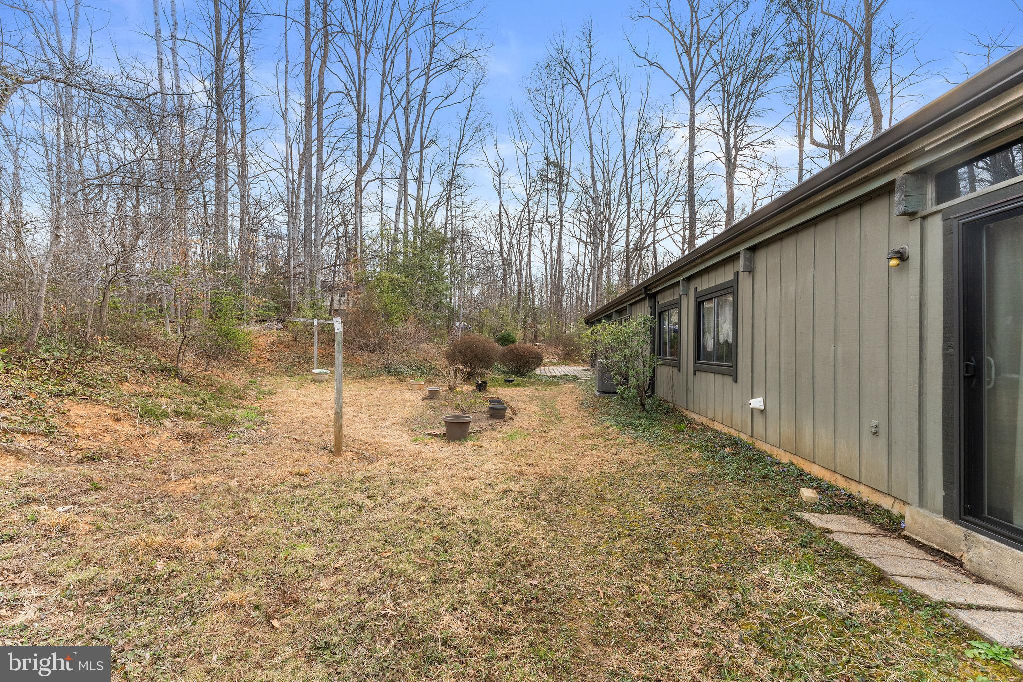 7202 Danny Lane Manassas, VA 20112 - Photo 52 of 54 a backyard of a house with table and chairs