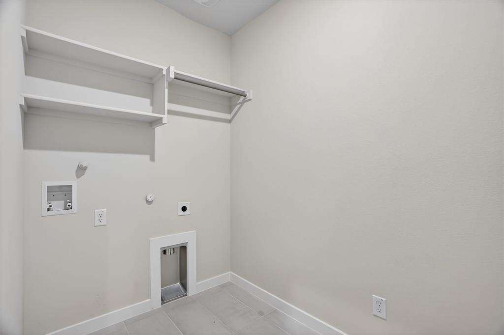 321 Skeen Peak Springtown, TX 76082 - Photo 21 of 37 Dedicated laundry area featuring light-toned walls, white trim, and light grey tile flooring