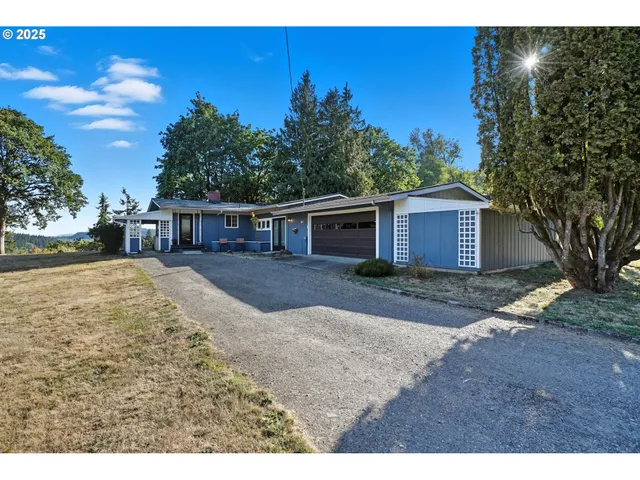 a view of house with outdoor space and sitting area