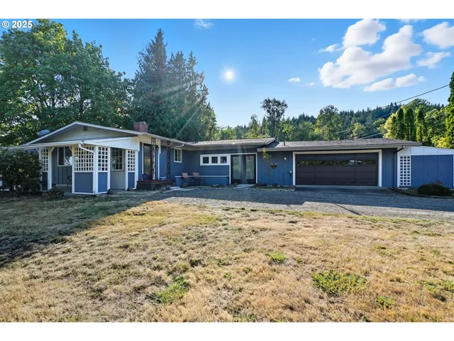 a backyard of a house with a fountain