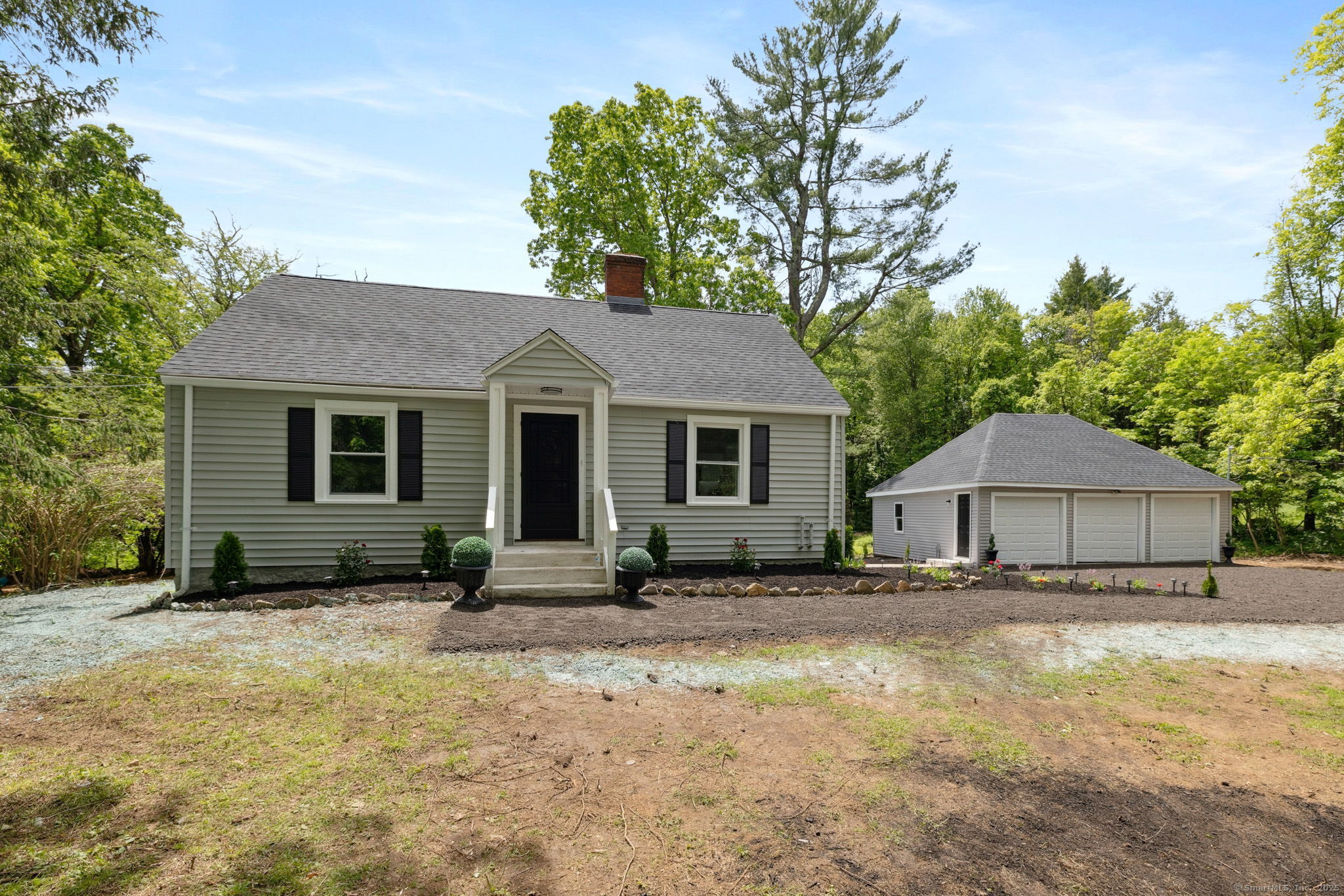 a front view of a house with a yard