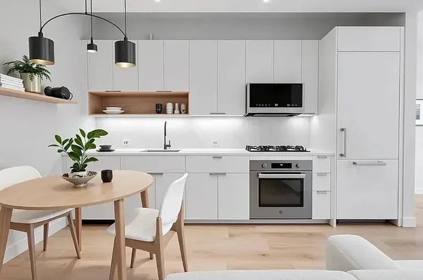 a kitchen with stainless steel appliances a white table and chairs in it