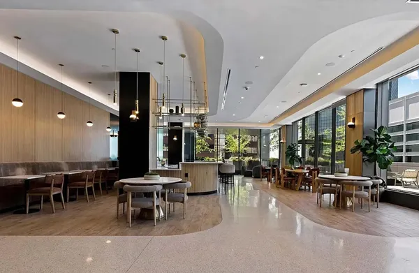 a living room with lots of furniture and white walls