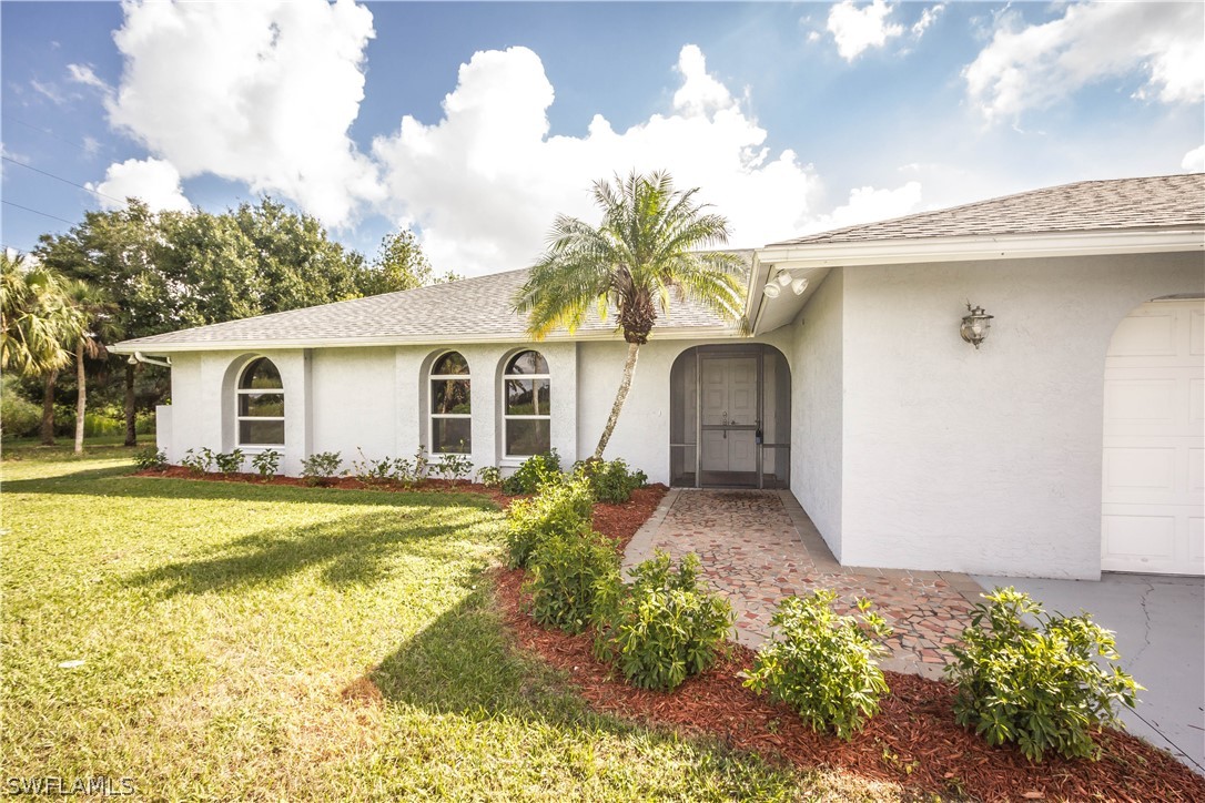 2871 Styles Road Alva, FL 33920 - Photo 4 of 33 front view of a house with a yard