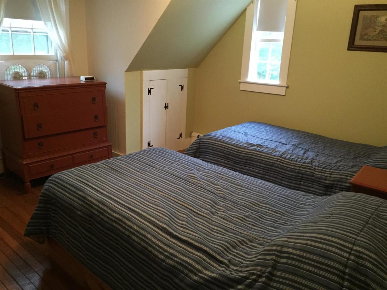 65 Mill Hill Road Wellfleet, MA 02667 - Photo 14 of 17 a bedroom with a bed and a window
