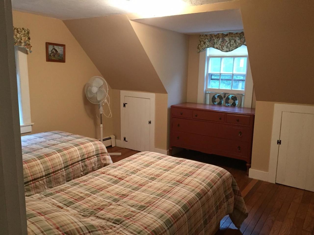 65 Mill Hill Road Wellfleet, MA 02667 - Photo 16 of 17 a bedroom with a bed and a window