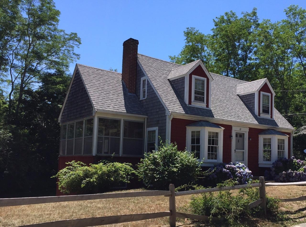 65 Mill Hill Road Wellfleet, MA 02667 - Photo 2 of 17 a front view of a house with a garden