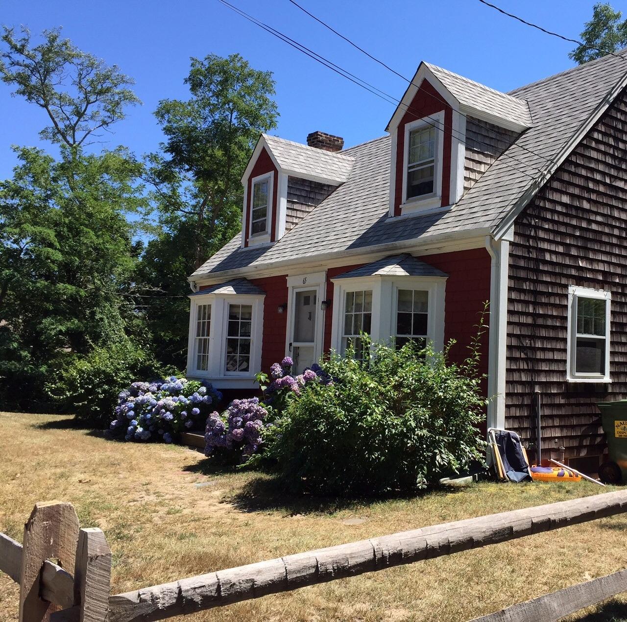 65 Mill Hill Road Wellfleet, MA 02667 - Photo 3 of 17 front view of a house with a yard