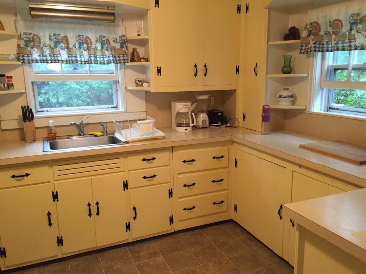 65 Mill Hill Road Wellfleet, MA 02667 - Photo 8 of 17 a room with cabinets and window
