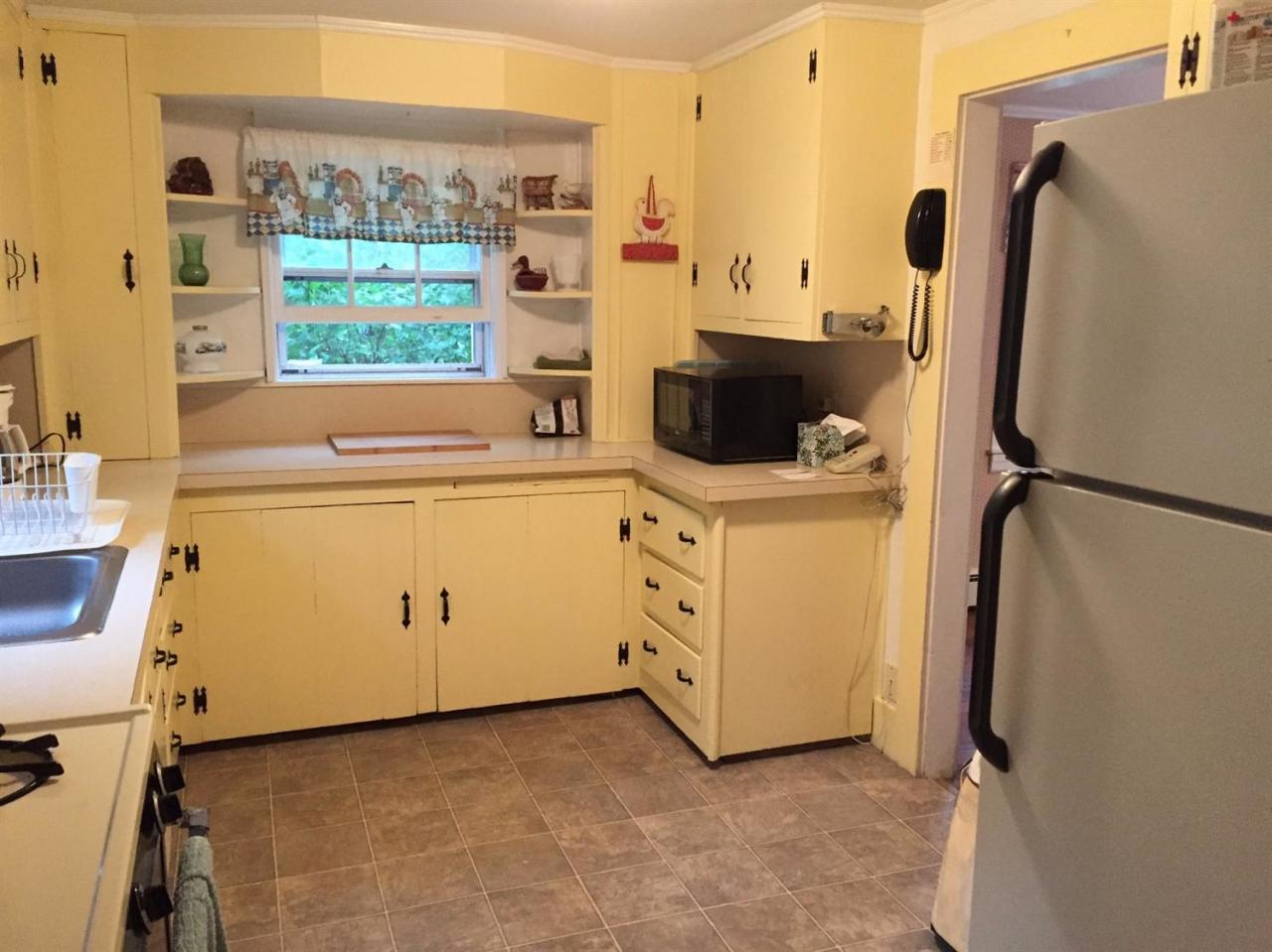 65 Mill Hill Road Wellfleet, MA 02667 - Photo 9 of 17 a view of a kitchen with washer and dryer