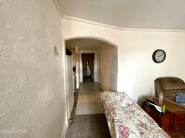 a bedroom with a bed and a chair