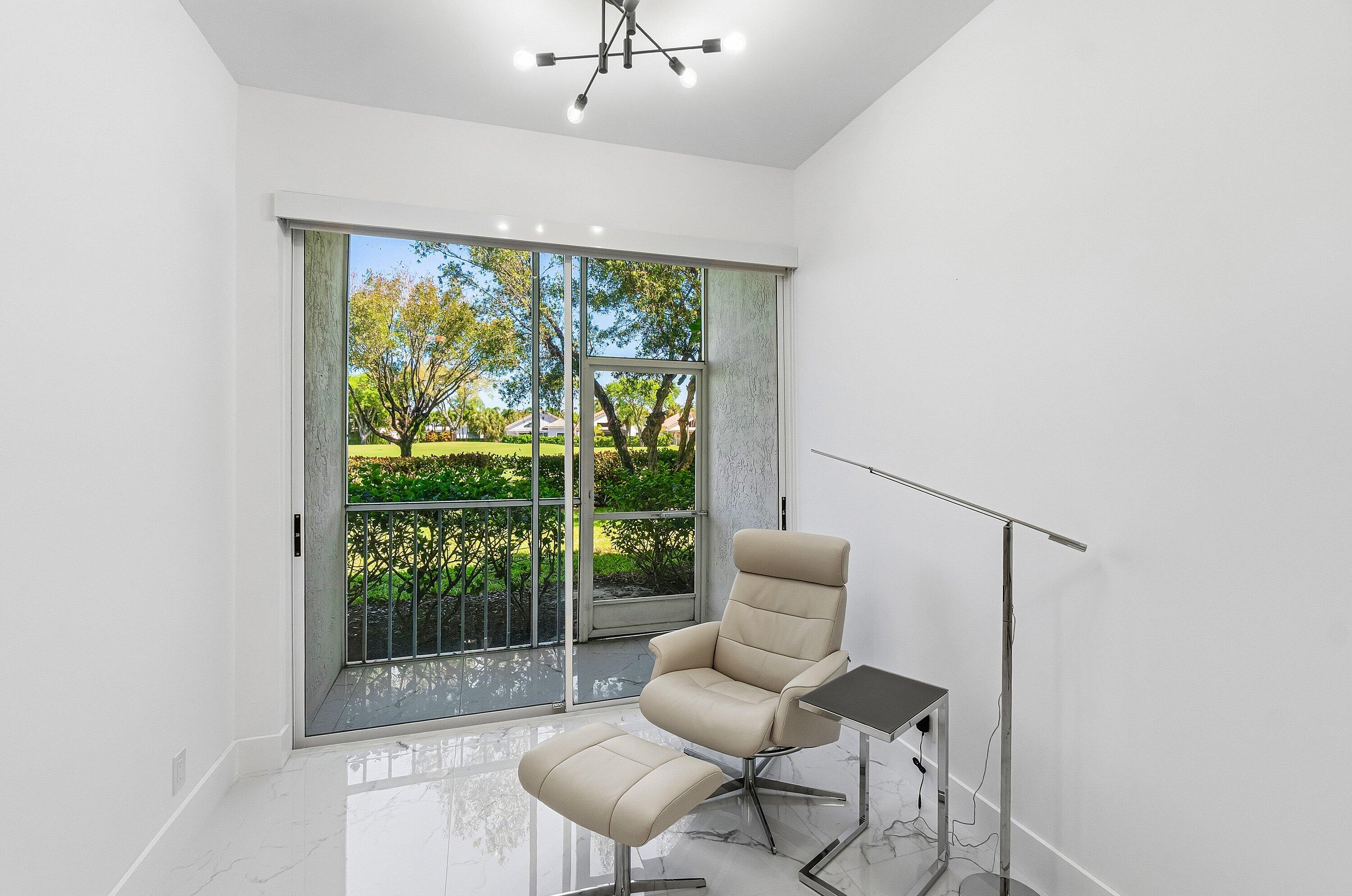 5082 Lake Catalina Drive, Unit A Boca Raton, FL 33496 - Photo 14 of 35 a living room with furniture and a window