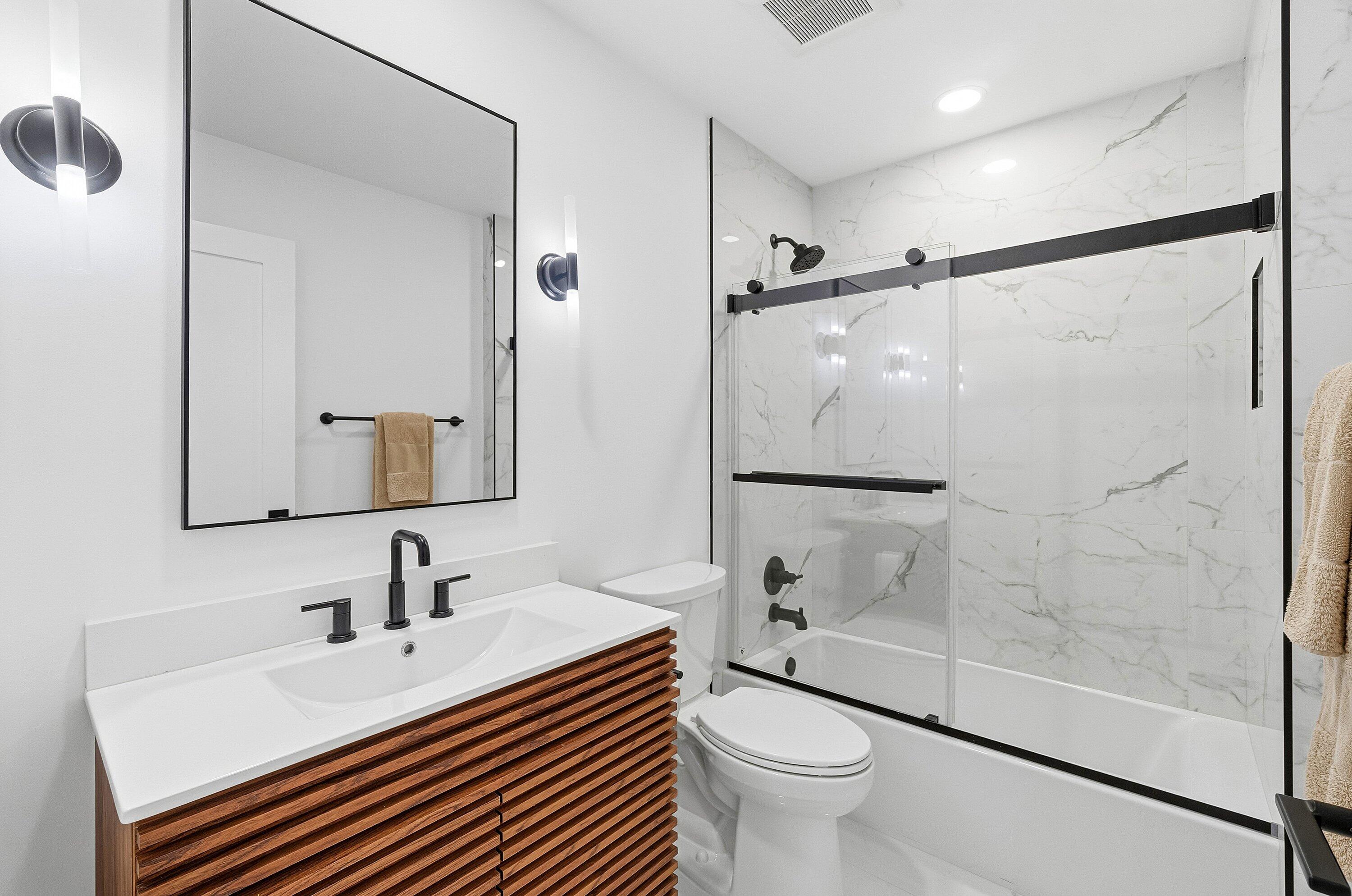 5082 Lake Catalina Drive, Unit A Boca Raton, FL 33496 - Photo 20 of 35 a bathroom with a sink toilet and shower