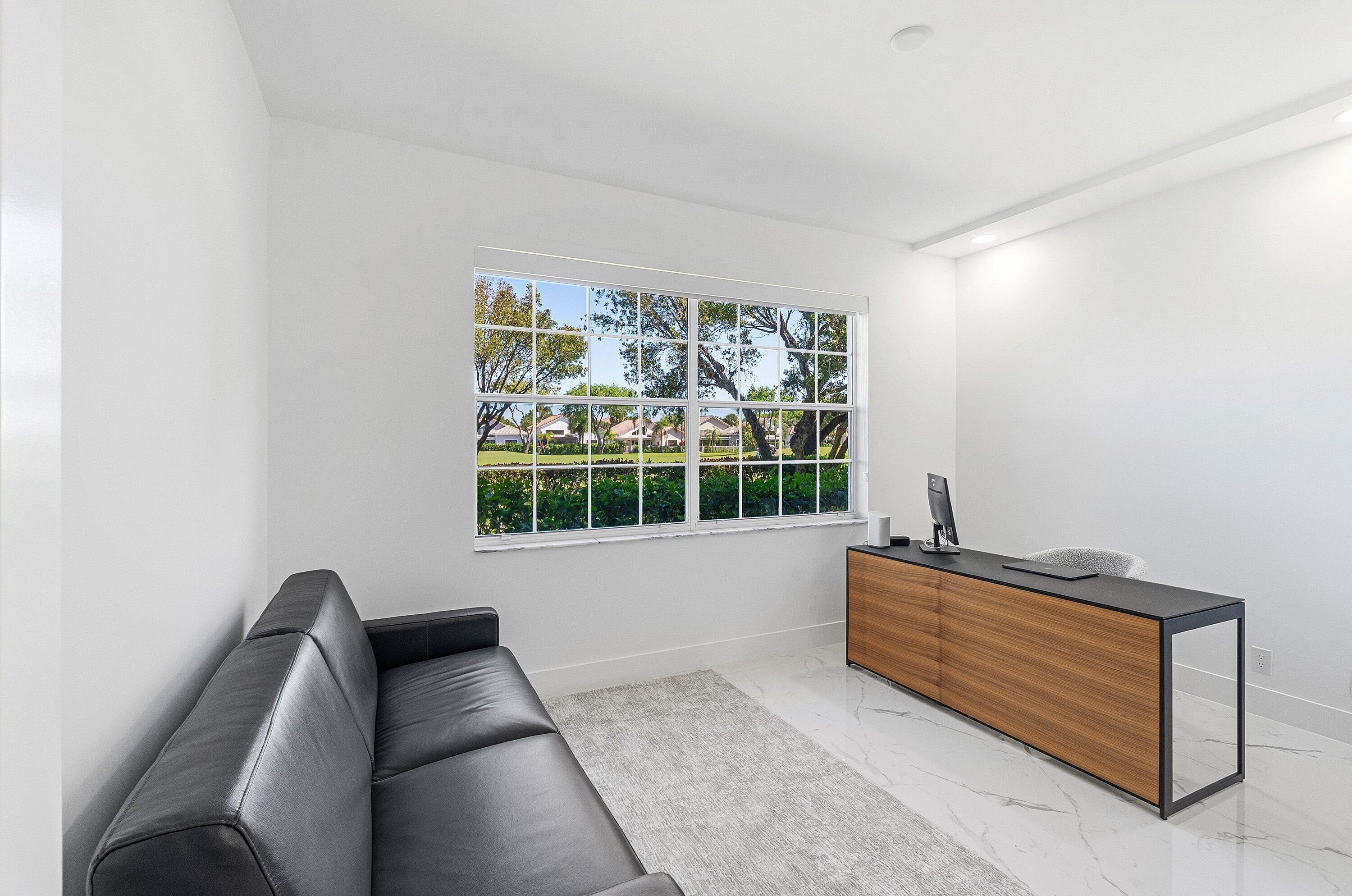 5082 Lake Catalina Drive, Unit A Boca Raton, FL 33496 - Photo 21 of 35 a living room with furniture and a window