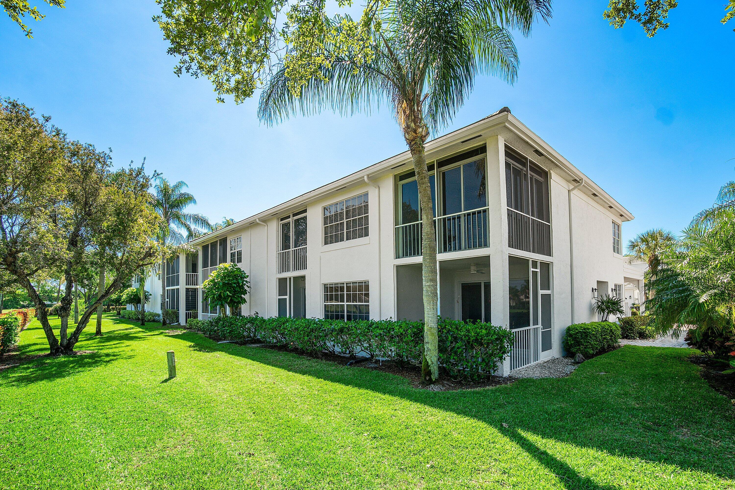 5082 Lake Catalina Drive, Unit A Boca Raton, FL 33496 - Photo 25 of 35 a front view of house with yard and green space