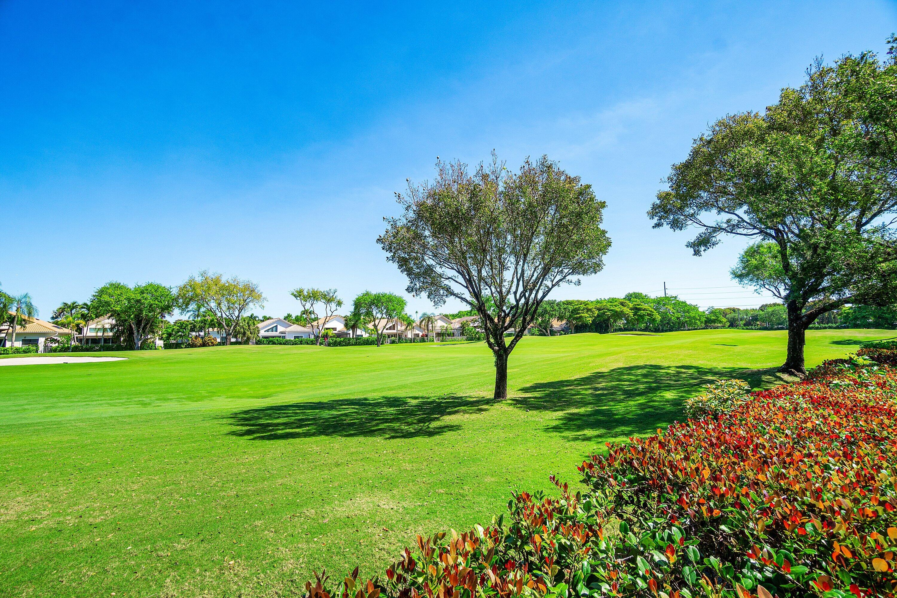 5082 Lake Catalina Drive, Unit A Boca Raton, FL 33496 - Photo 26 of 35 a view of a golf course with a garden