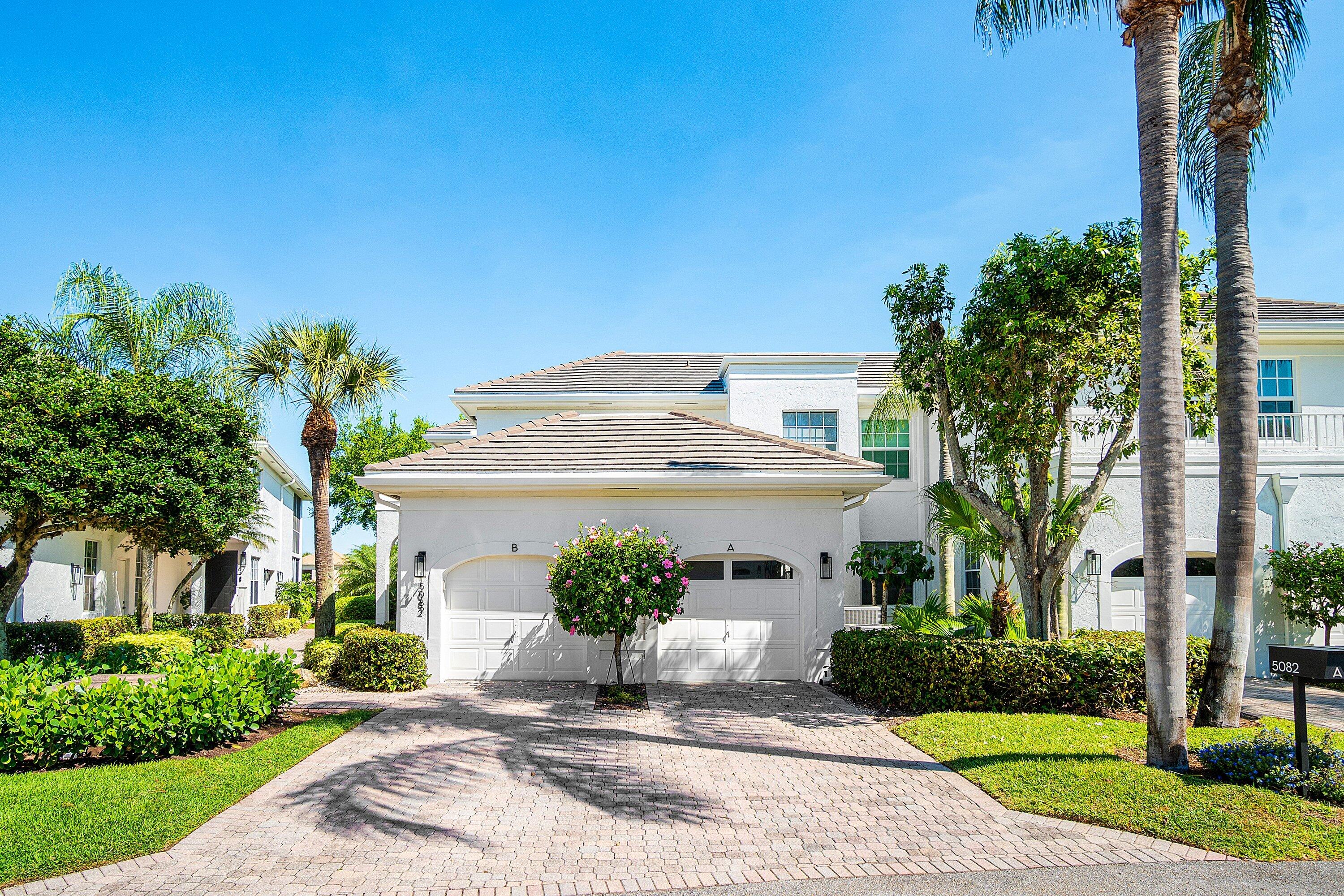 5082 Lake Catalina Drive, Unit A Boca Raton, FL 33496 - Photo 27 of 35 a view of a house with a yard and potted plants