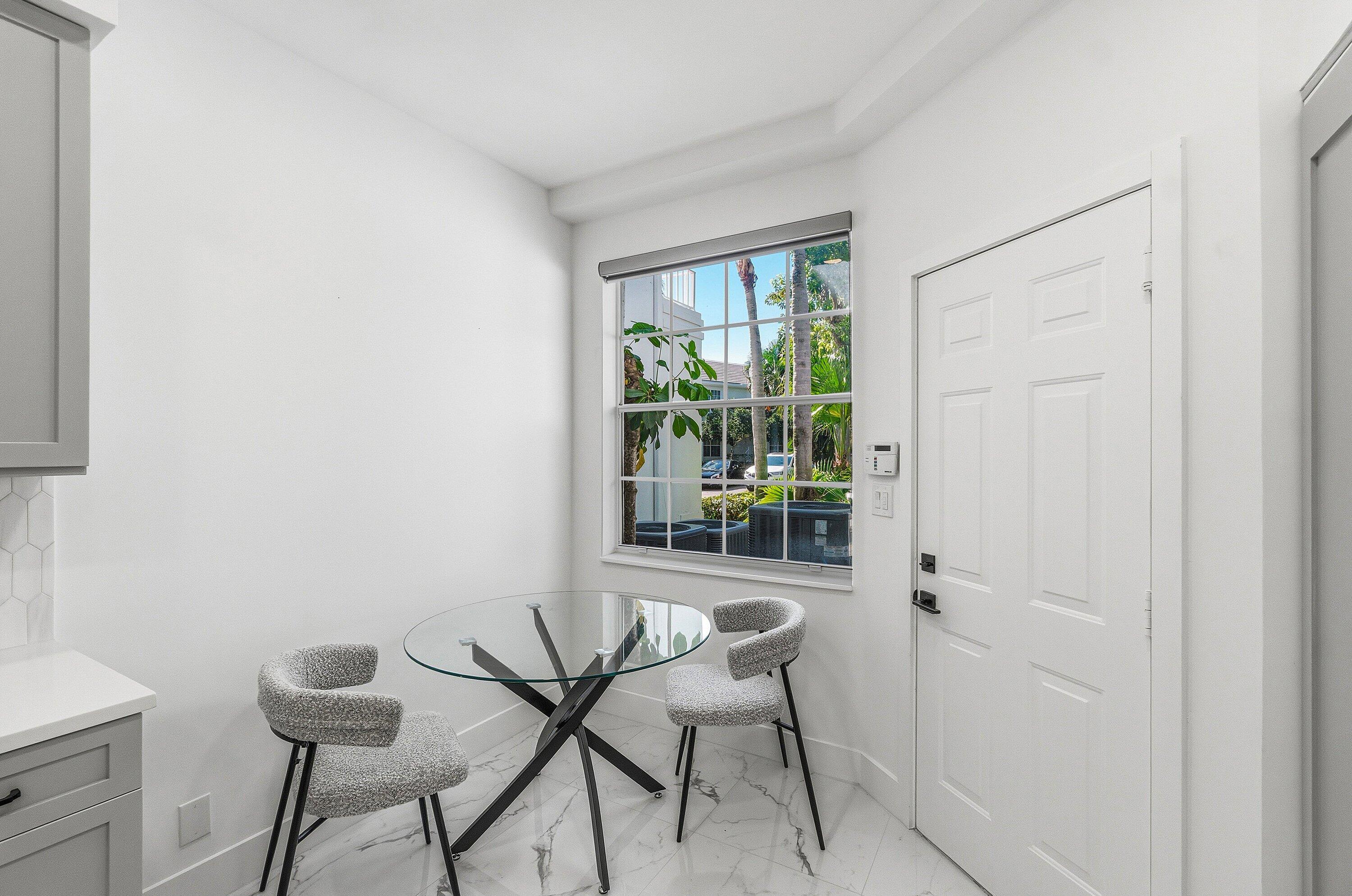 5082 Lake Catalina Drive, Unit A Boca Raton, FL 33496 - Photo 10 of 35 a dining room with furniture and a window