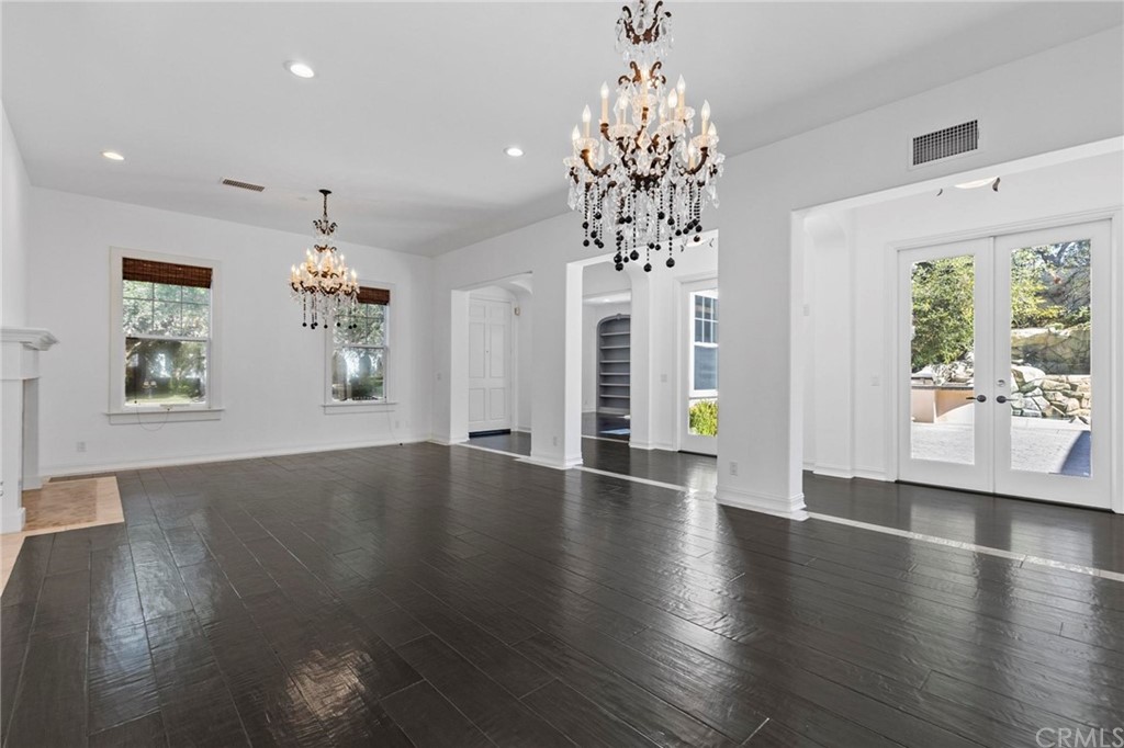 3 Seabluff Newport Beach, CA 92660 - Photo 15 of 75 a view of an empty room with wooden floor and a window