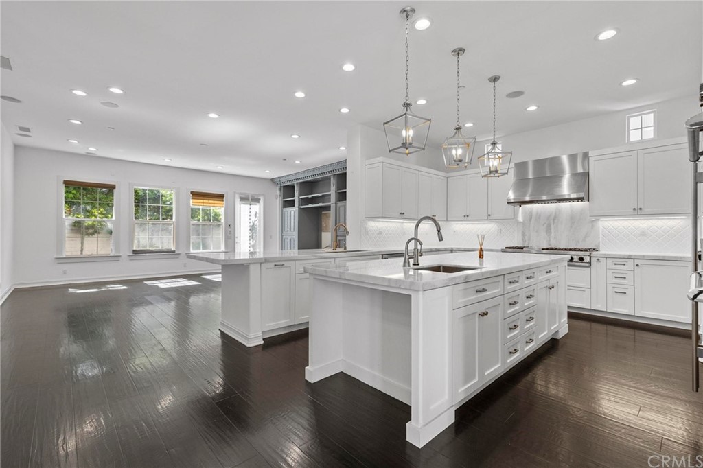 3 Seabluff Newport Beach, CA 92660 - Photo 25 of 75 a large white kitchen with lots of counter space sink and cabinets