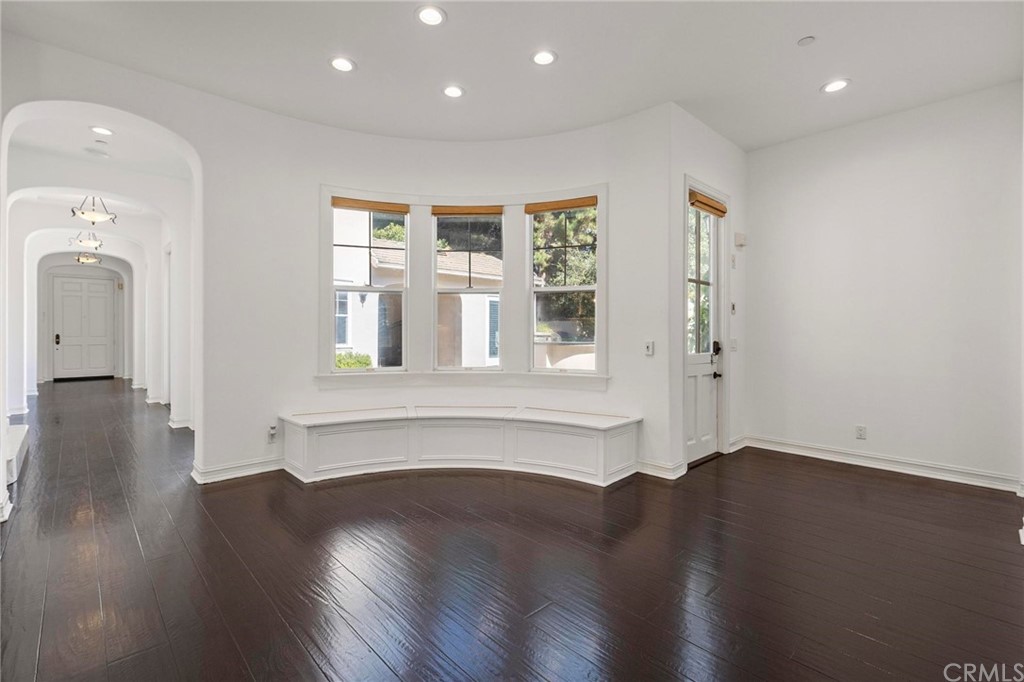 3 Seabluff Newport Beach, CA 92660 - Photo 26 of 75 an empty room with wooden floor and windows