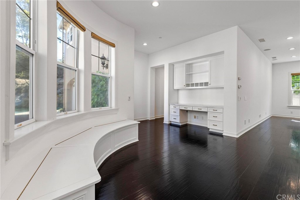 3 Seabluff Newport Beach, CA 92660 - Photo 30 of 75 a view of an empty room with wooden floor and a window