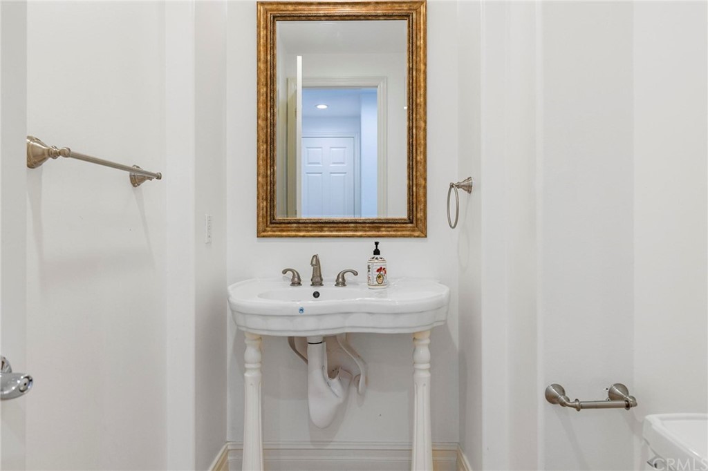 3 Seabluff Newport Beach, CA 92660 - Photo 31 of 75 a bathroom with a sink and a mirror