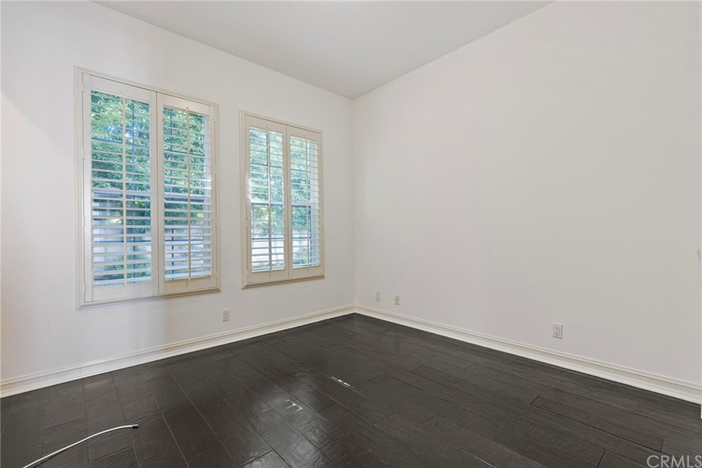 3 Seabluff Newport Beach, CA 92660 - Photo 32 of 75 an empty room with wooden floor and windows