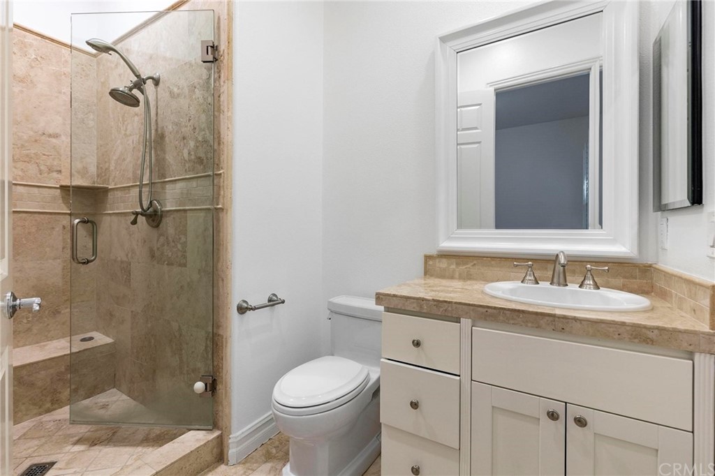 3 Seabluff Newport Beach, CA 92660 - Photo 34 of 75 a bathroom with a granite countertop sink toilet and shower