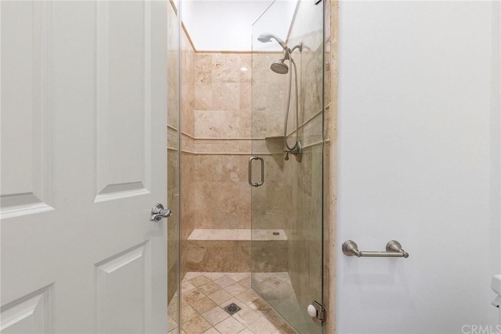 3 Seabluff Newport Beach, CA 92660 - Photo 35 of 75 a bathroom with a glass shower door
