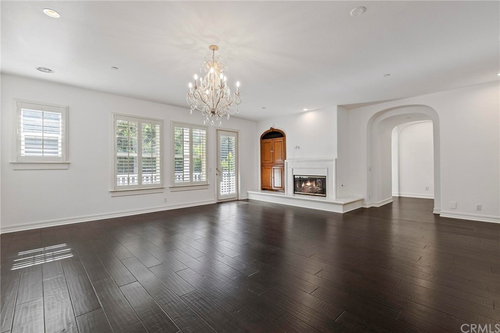 3 Seabluff Newport Beach, CA 92660 - Photo 39 of 75 a view of an empty room with wooden floor and a window