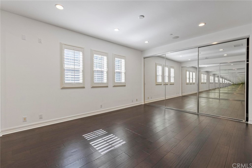 3 Seabluff Newport Beach, CA 92660 - Photo 47 of 75 an empty room with wooden floor and windows