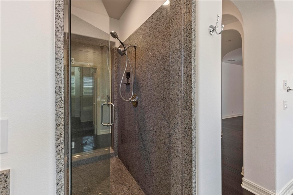 3 Seabluff Newport Beach, CA 92660 - Photo 52 of 75 a bathroom with a glass shower door