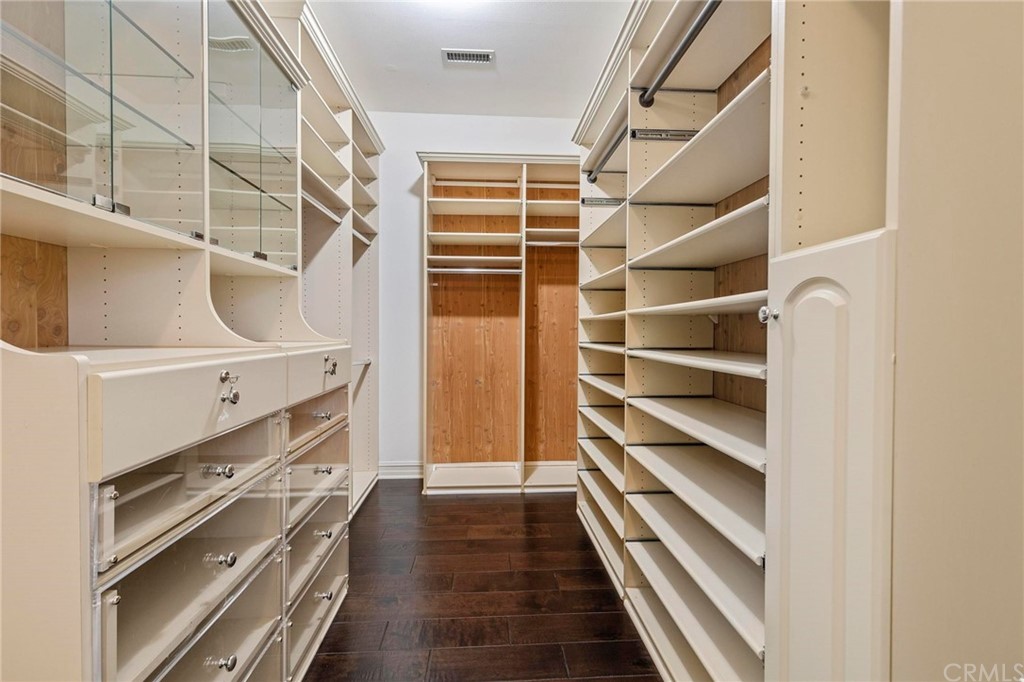 3 Seabluff Newport Beach, CA 92660 - Photo 55 of 75 a view of walk in closet and wooden floor