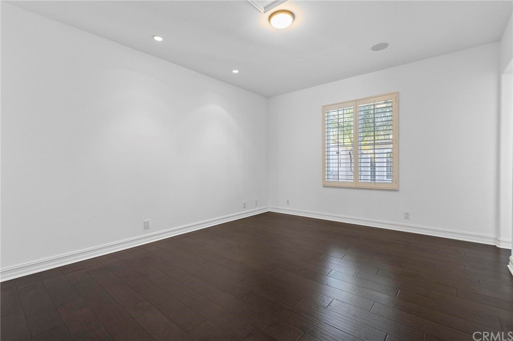 3 Seabluff Newport Beach, CA 92660 - Photo 56 of 75 an empty room with wooden floor and windows