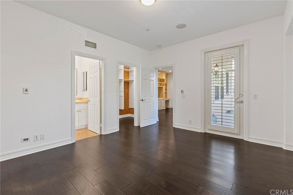 3 Seabluff Newport Beach, CA 92660 - Photo 62 of 75 an empty room with wooden floor and windows
