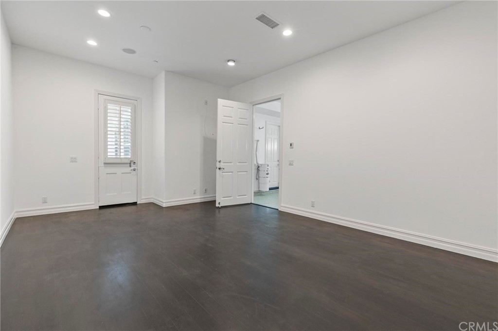 3 Seabluff Newport Beach, CA 92660 - Photo 66 of 75 an empty room with wooden floor and window