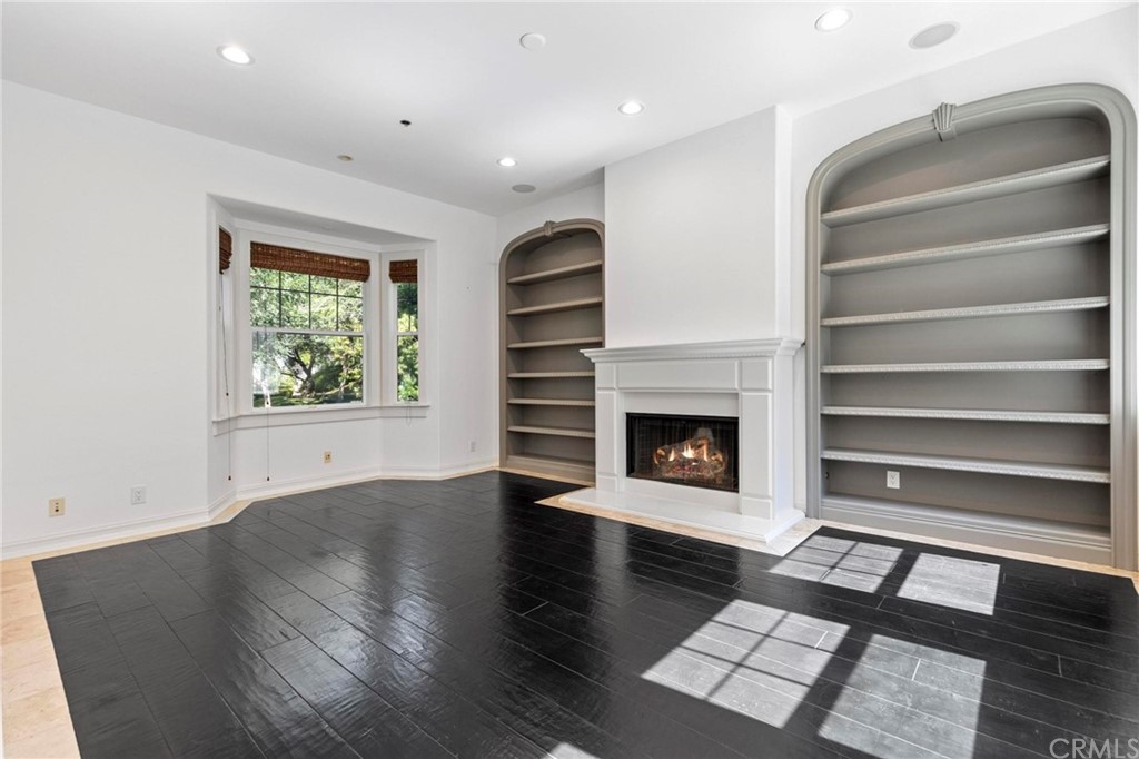 3 Seabluff Newport Beach, CA 92660 - Photo 7 of 75 a view of an empty room with a fireplace and a window