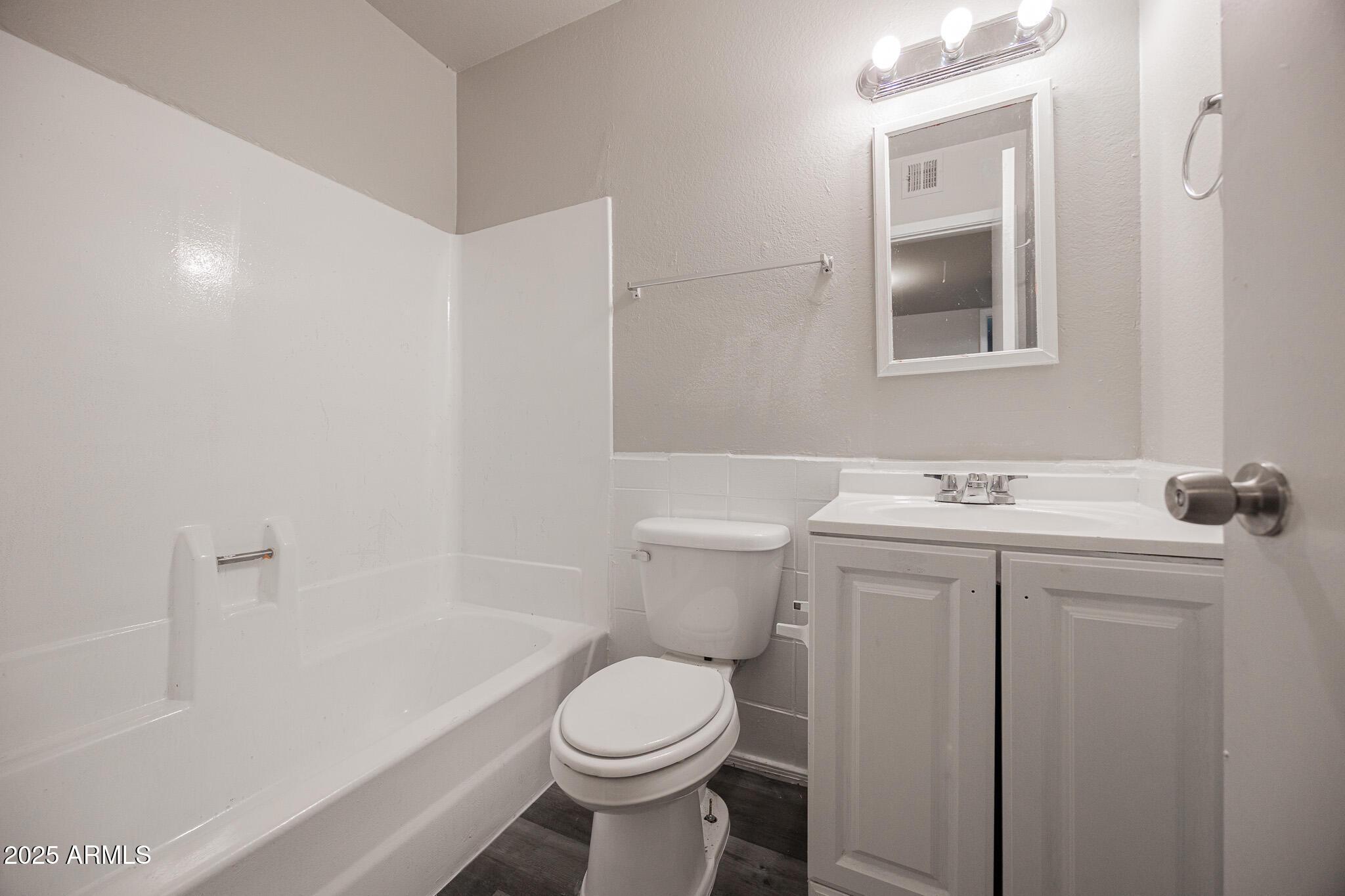 1703 West Mountain View Road, Unit 14 Phoenix, AZ 85021 - Photo 14 of 14 a bathroom with a sink toilet and shower